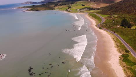 road on new zealand coast reveal beautiful landmark aerial drone shot