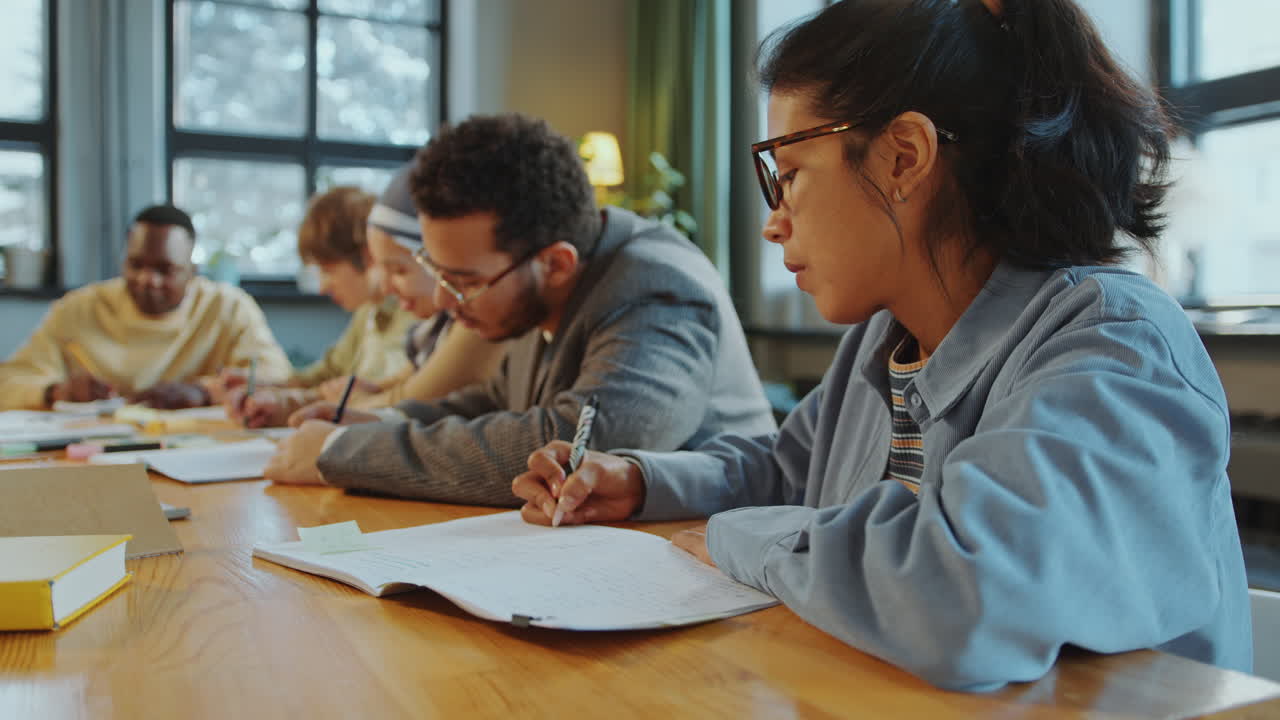 Hispanic Female Student Taking Notes during Foreign Language Class
