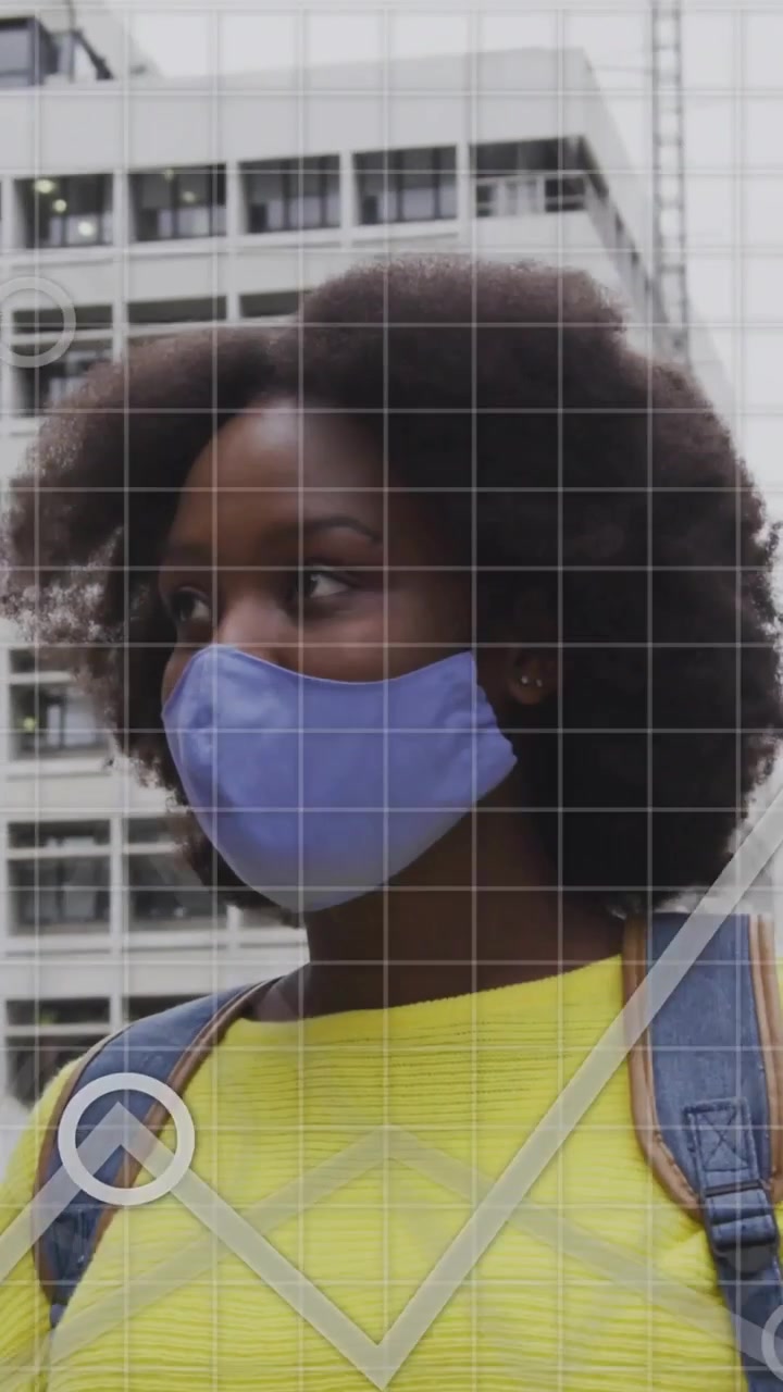 Vertical video: Woman standing by building, map and charts appearing over torso, showing IT data