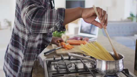 senior man cooking in the kitchen