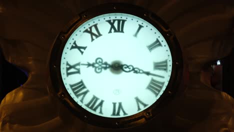 shooting in time lapse mode. passing of time. the hands of the clock. evening light. time is running. watch on the street.