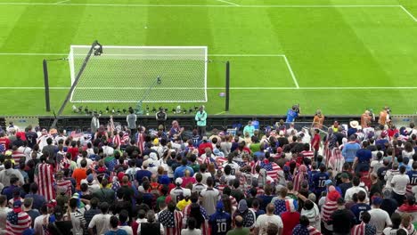 football fans chanting happily support football team usa couple family friends sit in seat back of the gate applaud relax in a scenic view wide angel camera is recording birdseye in the stadium