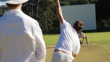 bowler delivering ball during cricket match