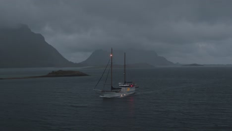 sailboat in the arctic lofoten sailing during a storm