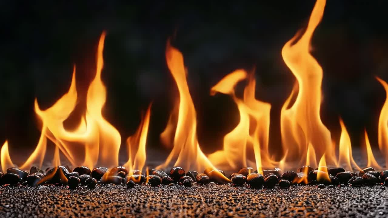 Vibrant Flames Dancing Over Dark Stones