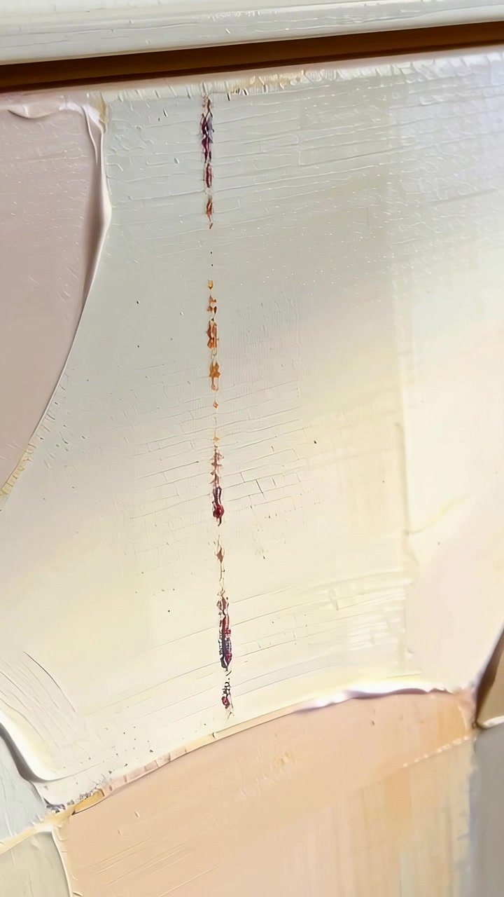 Vertical video: Panning camera showing studio panel revealing fleck line and knife marks for detail