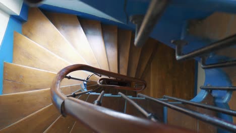 round old wooden spiral staircase in 4k slow motion 60fps