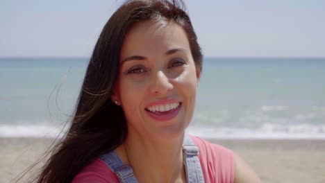 Close-up-of-happy-lady-with-ocean-background