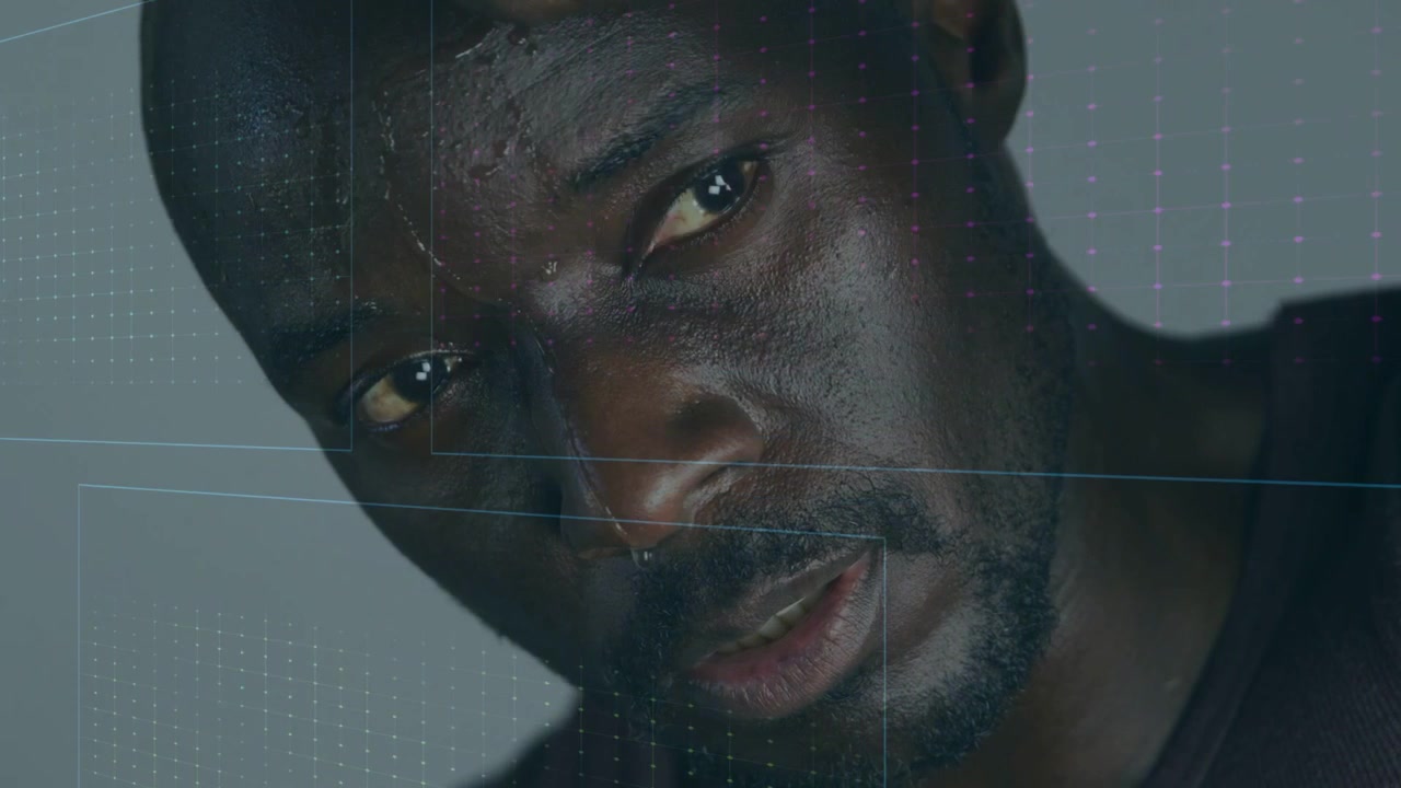 HUD panels sliding, mature African American man holding hand, waveforms shifting, showing vitals