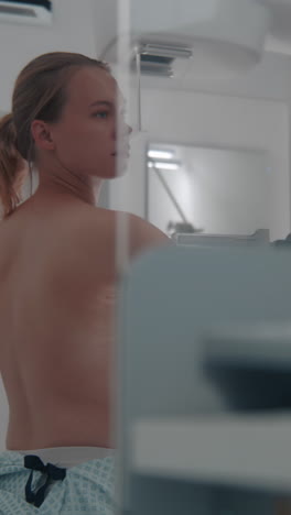 woman undergoing a mammogram