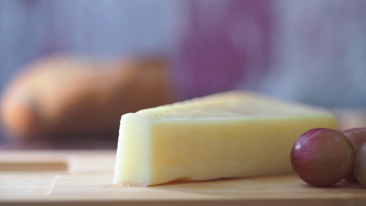 Cutting Cheese with Grapes