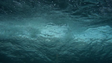 underwater shot of wave breaking slow motion in canary islands