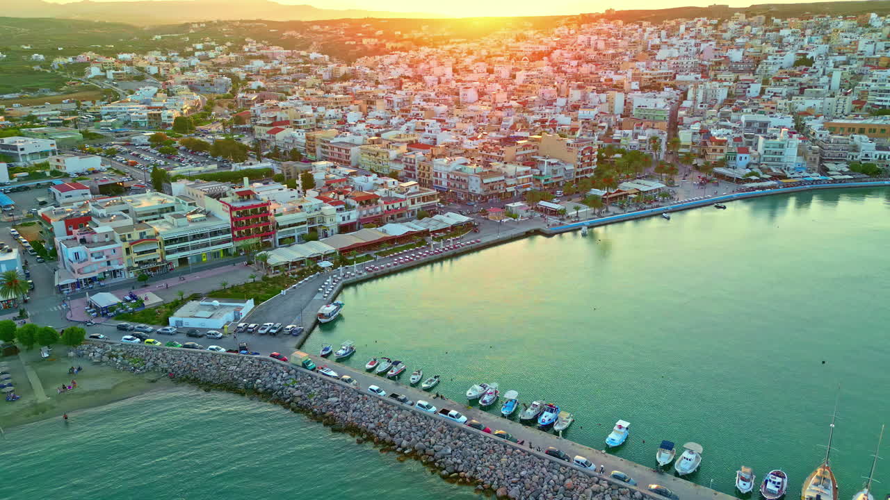 Sunset at the port town of Sitia or Siteia in the municipality in Lasithi, Crete, Greece - push in descent of the marina