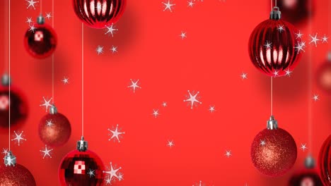 Animation-of-snow-falling-over-christmas-bauble-decorations-on-red-background