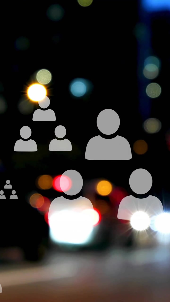 Animation of profile icon flowcharts over blurred vehicles stopped on red signal in street of city