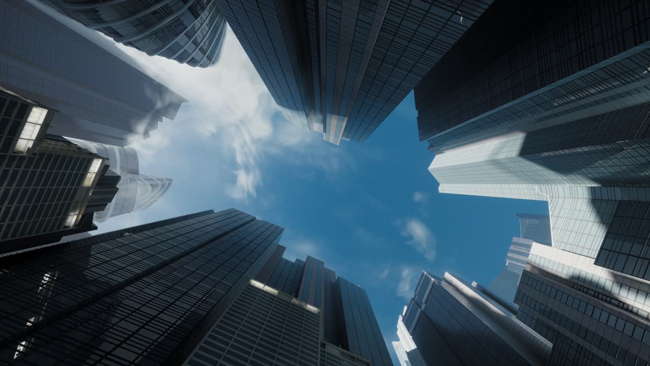 vista de bajo ángulo de los edificios espejados de vidrio. centro de negocios con nubes en el cielo azul
