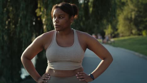 Focus-woman-breathing-after-the-running-at-the-park.