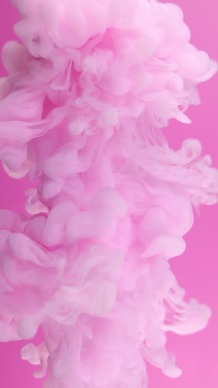 Aesthetic pink fluid cloud swirls gently, offering a mesmerizing vertical backdrop for design and branding.