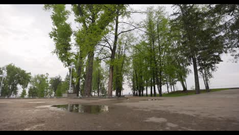 Woman Exercising in a Park on a Rainy Day