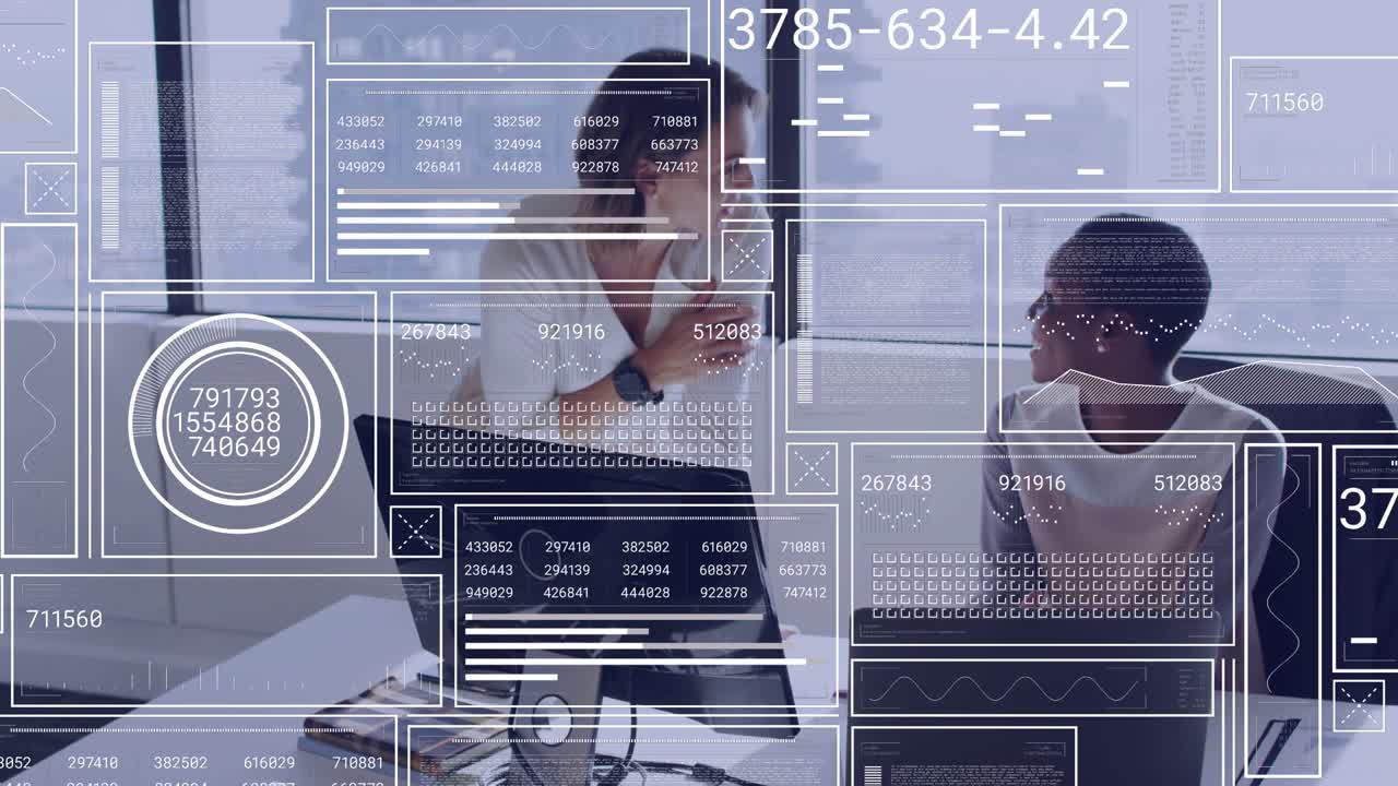 Standing woman gesturing as HUD updating, guiding seated woman toward laptop for business analysis