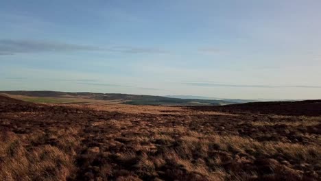 Smooth-Aerial-Reveal-over-Denbigh-Moors,-North-Wales-in-4K