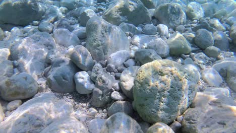 sun beams reflecting under sea water reflecting through clean transparent and high visibility of shallow lagoon in mediterranean