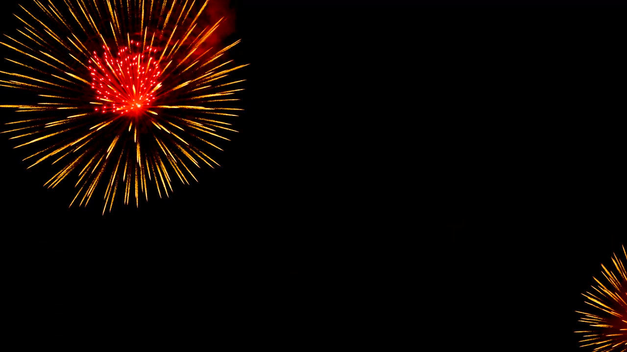 Close up of beautiful shiny golden and red fireworks display in celebration night