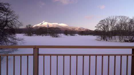 stunning view of komagatake in hokkaido, japan from bridge