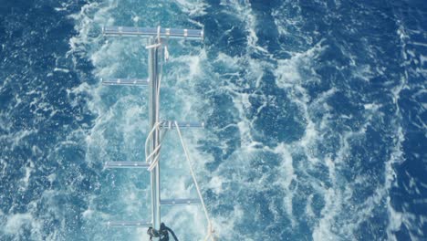 water foaming behind a boat