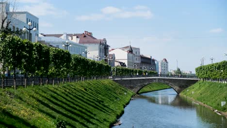 cityscape with canal and bridge