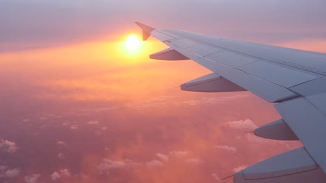 window point of view of the sun in a plane, seeing wing aircraft. location paris