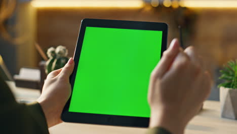 unknown businesswoman using chromakey tablet for internet surfing office closeup