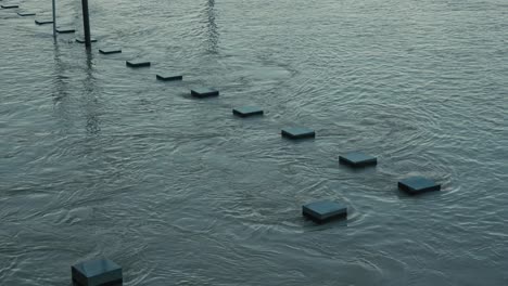 stepping stones in a flooded river