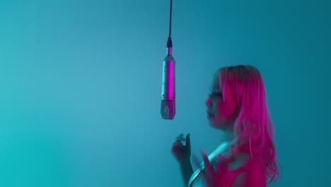 couple singing duet in neon studio