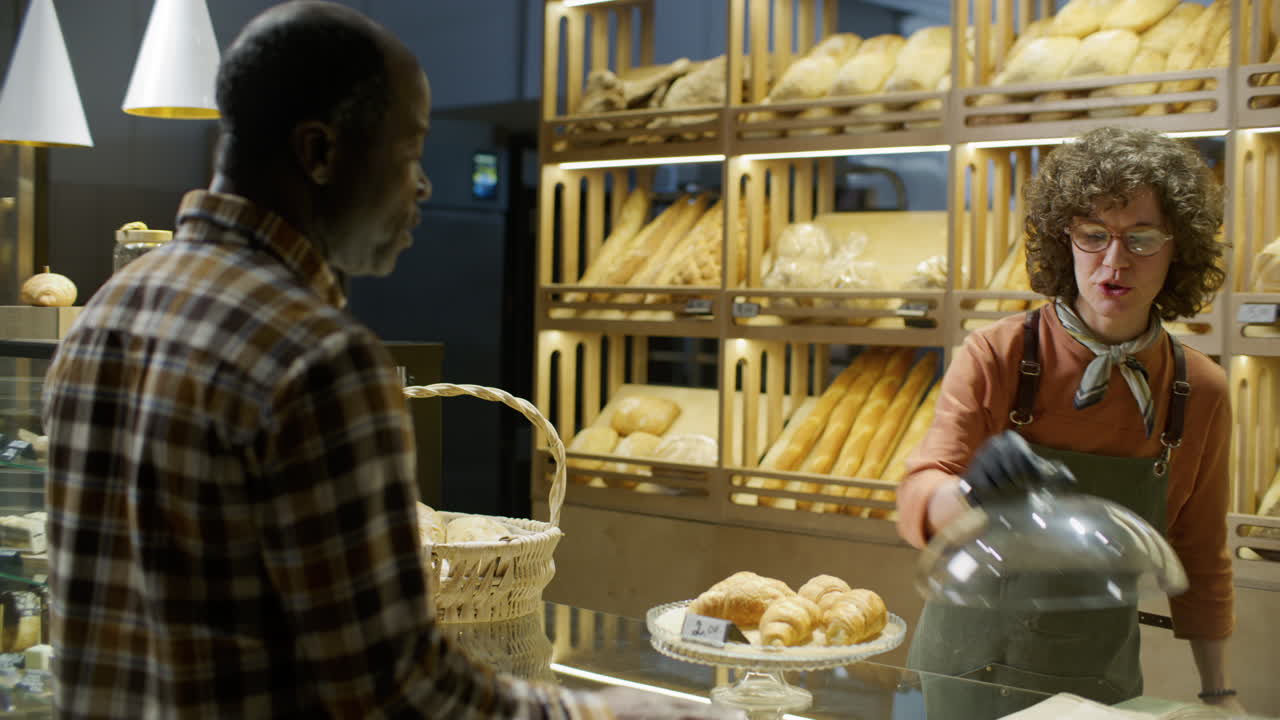 Customer Purchasing Bread at a Bakery