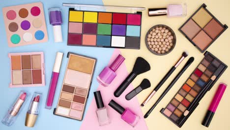 make up products move one by one on pastel background - stop motion