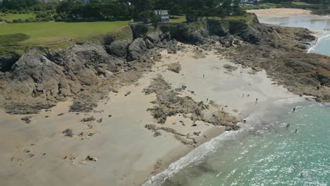 People-on-beach-of-Roche-Pelee,-Dinard-in-Brittany,-France