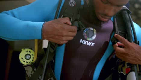 An-African-Marine-Biologist-Prepares-Diving-Equipment-For-A-Scuba-Dive-In-Kenyan-Conservation-Center