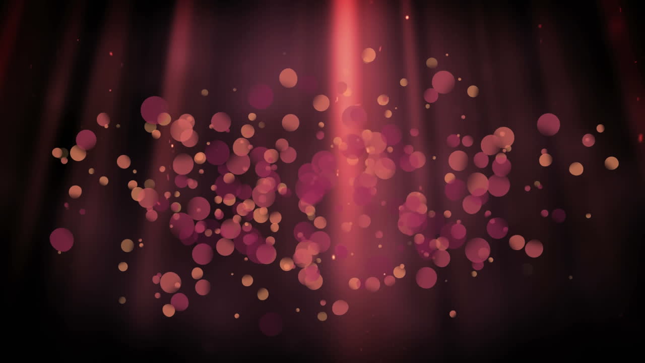 Luces rojas con efecto de burbujas sobre un fondo oscuro