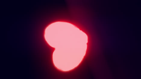 red energy heart shapes on a dark background