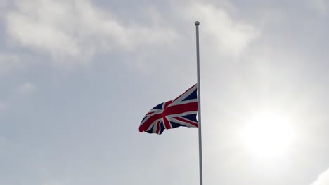 flag of the united kingdom half mast in the wind