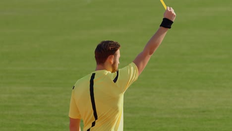 football soccer referee shows penalty yellow card, 4k, 75fps