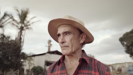 latin farmer man in the casual shirt in the farm on the farm background. cinematic 4k