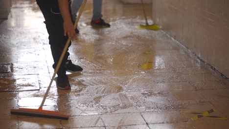 man washing floor to prevent coronavirus pandemic