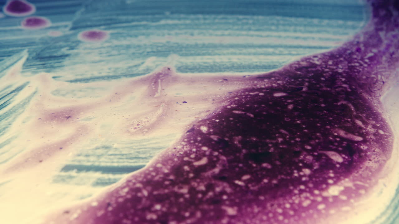 Colourful, organic, liquids macro shots buzzing and flowing