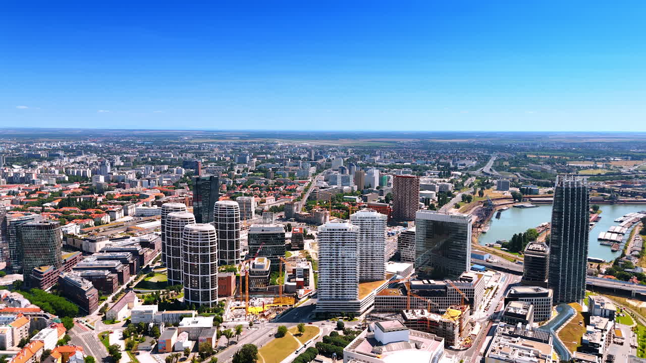 Bratislava skyline view. Bratislava's skyline features modern architecture and urban life under a blue sky, reflecting its vibrant atmosphere