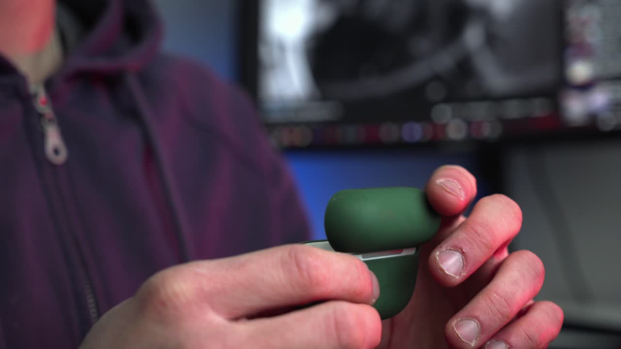 Man Take the airpods pro and put them on