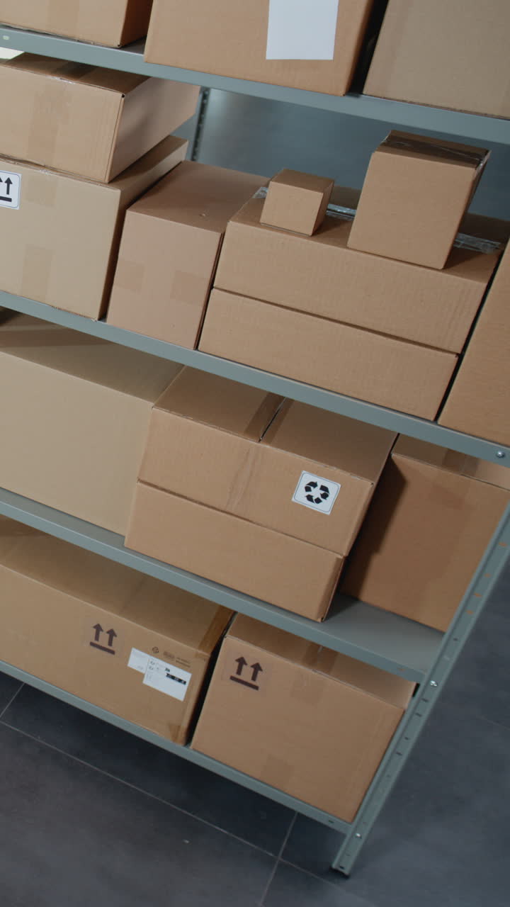 Stacked Cardboard Boxes on Metal Shelves