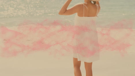 woman in white dress and hat enjoying beach with pink wave animation overlay