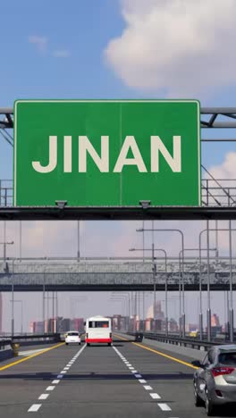 highway sign to jinan with airplane in the sky